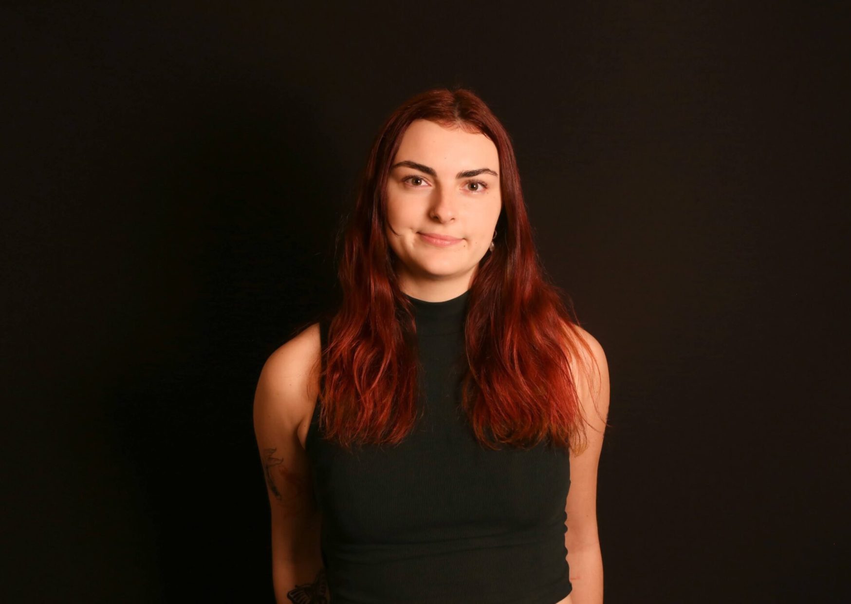 Red haired lady smiling for portrait photograph