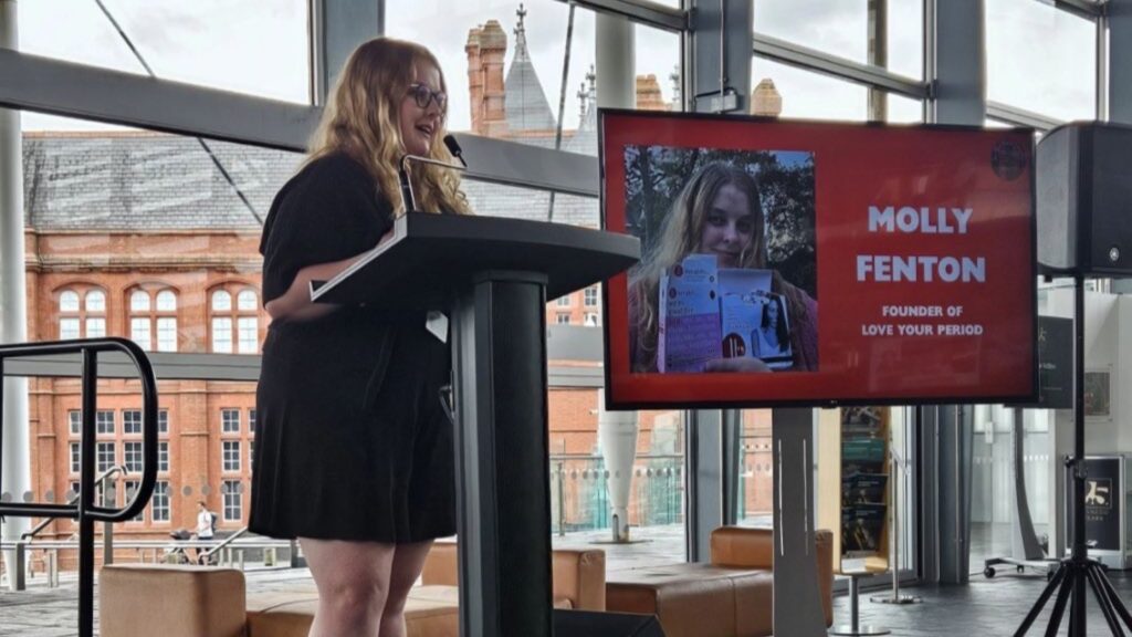 Molly Fenton giving a speech at the Senedd