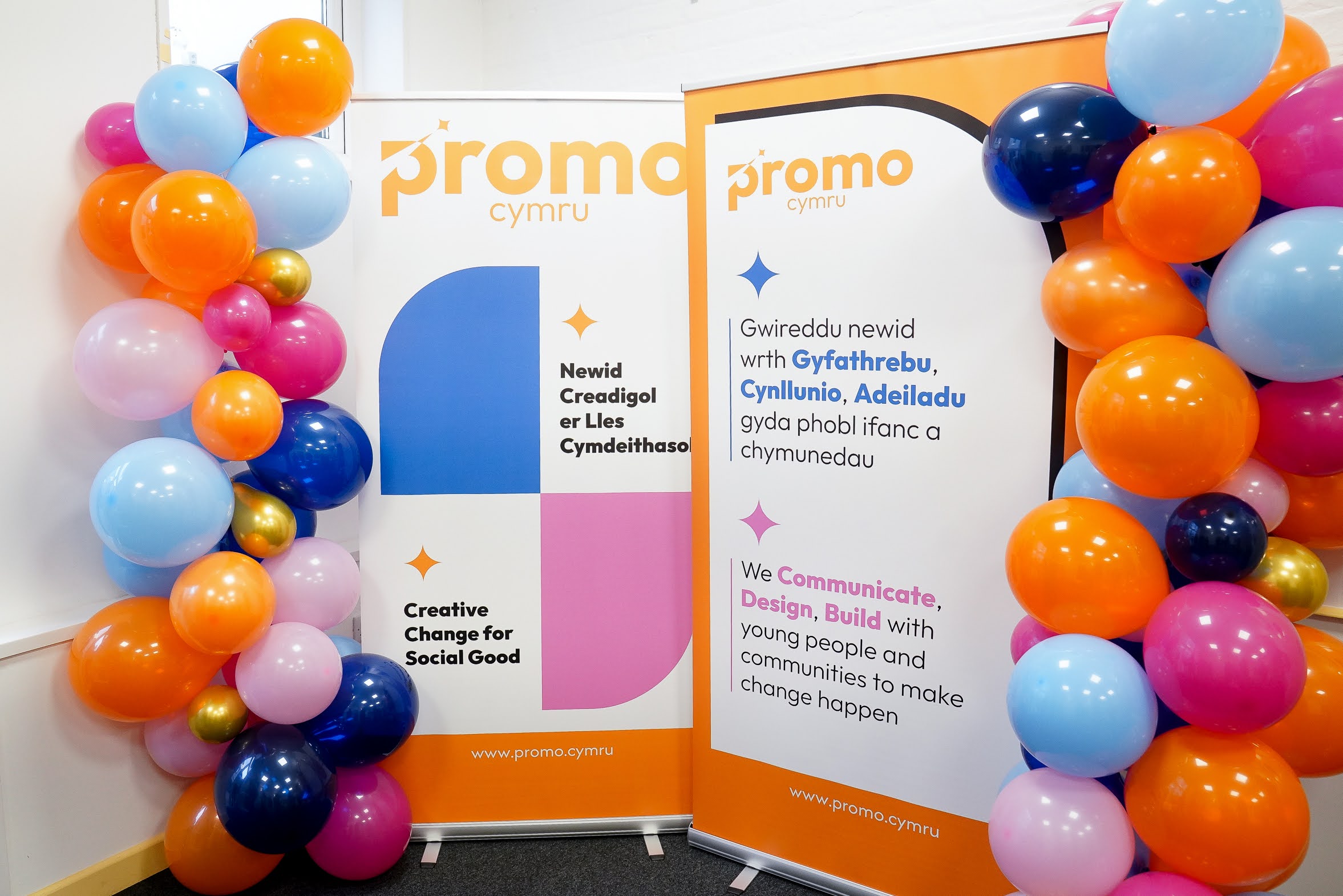Two pull up banners with balloon each side. They show the new ProMo Cymru branding and includes mission statements etc.