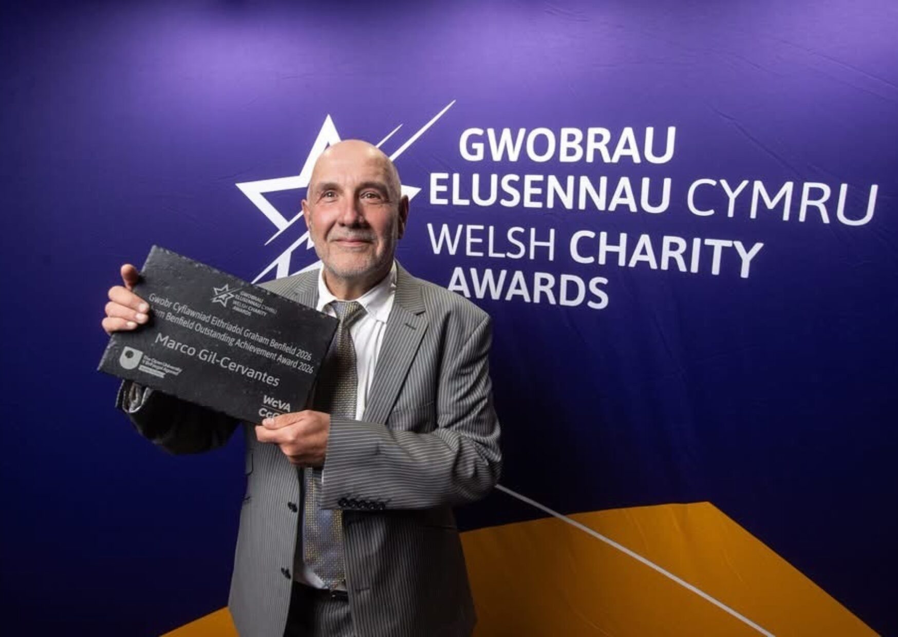 Marco holding his Award