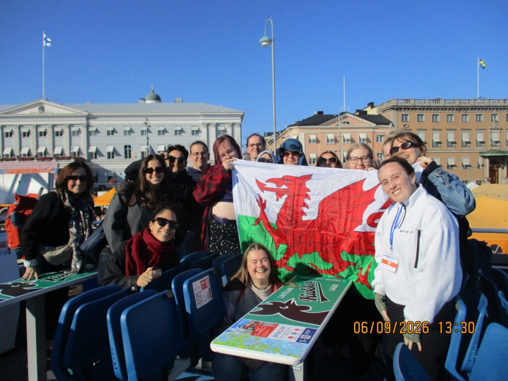 Group photo with the Welsh flag